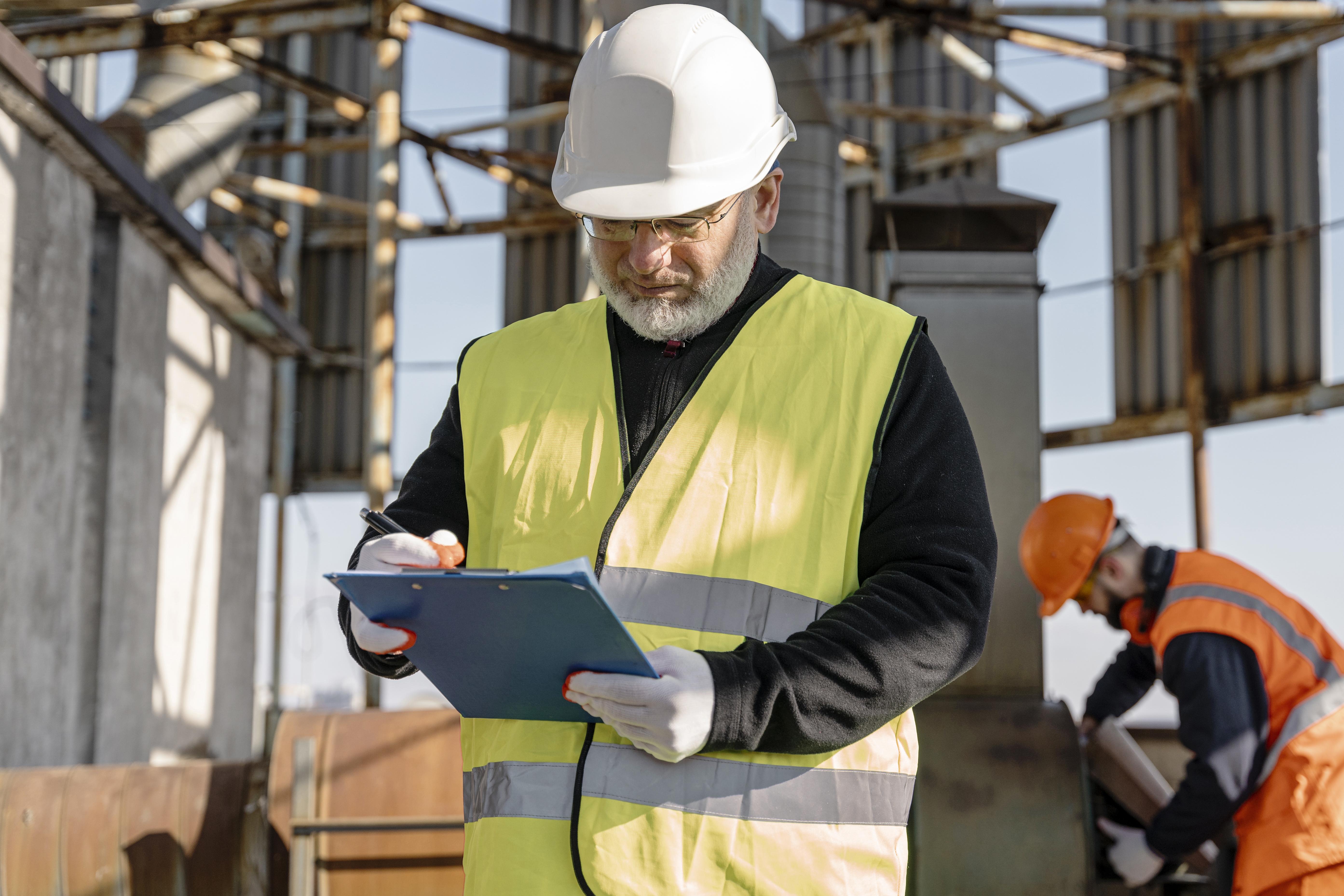 Construction Digital Solutions & BIM | BlueOC Civil Engineer Holding Clipboard.jpg